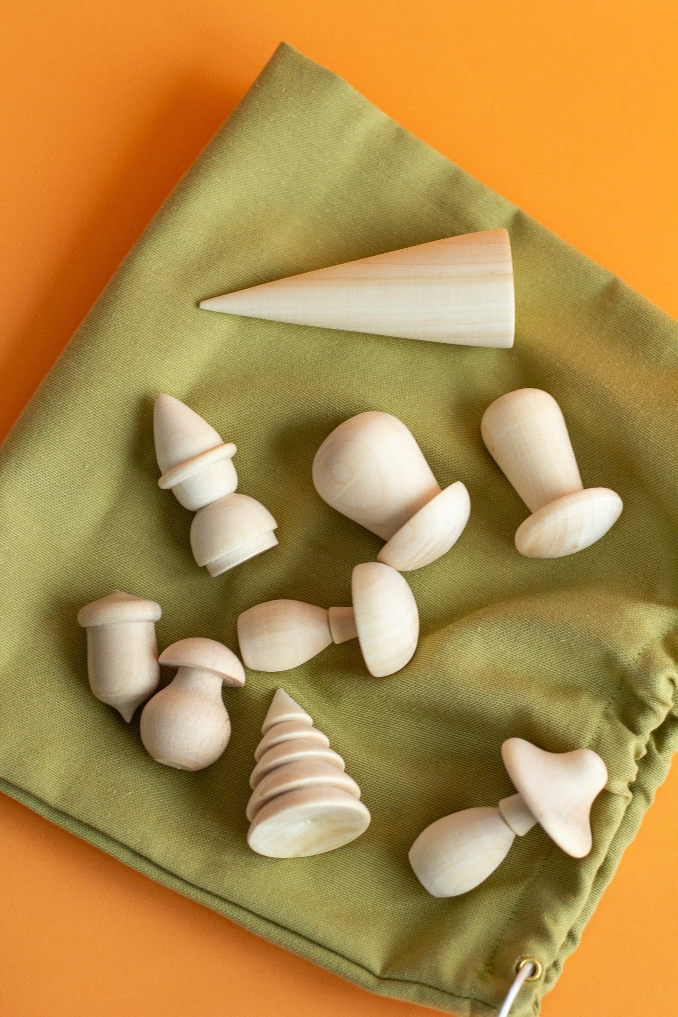 Set of wooden toys in a linen bag